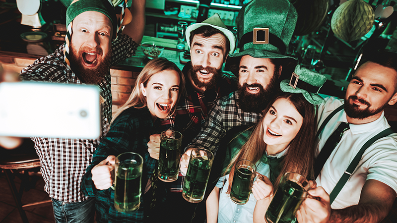 Group of Friends Celebrating St. Patrickâs Day at a Bar